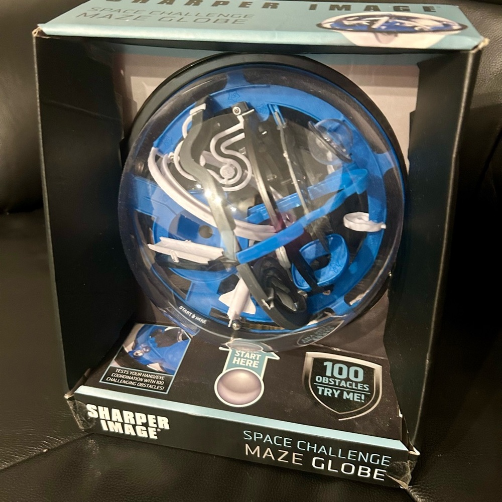 Sharper Image- space challenge maze globe. Brand new inbox. Perfect for a gift.
